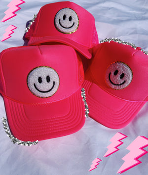 NEON PINK TRUCKER HAT WITH WHITE SMILEY FACE ☻